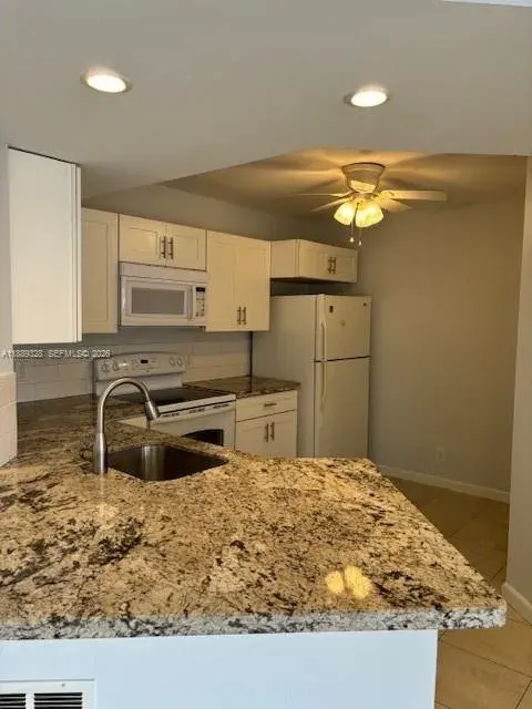 8977 Wiles Road 103, Coral Springs, FL 33067